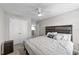 Serene bedroom with carpet, ceiling fan, and a neutral palette for relaxation at 35 Wolf Ridge Ct, Willow Springs, NC 27592