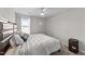 Tranquil bedroom features neutral tones, a ceiling fan, and a cozy bed at 35 Wolf Ridge Ct, Willow Springs, NC 27592