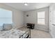 A cozy bedroom bathed in natural light with carpeted floors and neutral paint at 35 Wolf Ridge Ct, Willow Springs, NC 27592