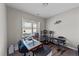 A music-themed bedroom with a keyboard, speakers, and plenty of natural light from the window at 35 Wolf Ridge Ct, Willow Springs, NC 27592