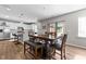 Dining area adjacent to kitchen features seating for four and bright lighting at 35 Wolf Ridge Ct, Willow Springs, NC 27592