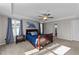 Primary bedroom with tray ceilings, ample natural light, and neutral colored walls at 35 Wolf Ridge Ct, Willow Springs, NC 27592