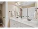 Bright bathroom with double vanity, stylish fixtures, and a large mirror creates a clean and modern space at 3504 Griffice Mill Rd, Raleigh, NC 27610