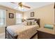 Cozy bedroom features neutral tones, a comfortable bed, and natural light from the large windows at 3504 Griffice Mill Rd, Raleigh, NC 27610