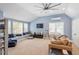 Inviting bonus room with large windows, a cozy seating area, and modern decor for relaxing at 3504 Griffice Mill Rd, Raleigh, NC 27610
