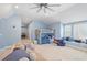 Upstairs bonus room featuring a bunk bed, a lounge area and multiple windows overlooking the surrounding area at 3504 Griffice Mill Rd, Raleigh, NC 27610