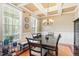 Formal dining room with coffered ceiling, chandelier, and wainscoting at 3504 Griffice Mill Rd, Raleigh, NC 27610