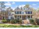 Beautiful two-story brick home with a large front porch and well-manicured landscaping at 3504 Griffice Mill Rd, Raleigh, NC 27610