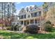 Charming two-story home with a welcoming front porch, manicured landscaping, and classic architectural details at 3504 Griffice Mill Rd, Raleigh, NC 27610