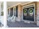 Inviting front porch with rocking chairs, perfect for relaxing and enjoying the outdoors at 3504 Griffice Mill Rd, Raleigh, NC 27610