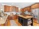 Gourmet kitchen featuring custom cabinets, granite countertops, and a center island with storage at 3504 Griffice Mill Rd, Raleigh, NC 27610
