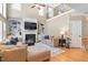 Spacious living room with a fireplace, built-in bookshelves, hardwood floors, and comfortable seating at 3504 Griffice Mill Rd, Raleigh, NC 27610
