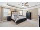 Main bedroom featuring neutral colors, carpet, a ceiling fan, and an ensuite bathroom at 3504 Griffice Mill Rd, Raleigh, NC 27610