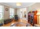 Comfortable sitting room with hardwood floors and large windows allowing natural light at 3504 Griffice Mill Rd, Raleigh, NC 27610