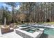 Luxurious pool area with spa and multiple lounge areas, perfect for outdoor relaxation and entertainment at 3504 Griffice Mill Rd, Raleigh, NC 27610