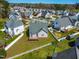 Aerial view of a landscaped backyard with a wooden deck and fence at 4005 Freesia Ct, Zebulon, NC 27597