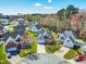 Aerial view of a neighborhood showcasing well-maintained homes and lush green spaces at 4005 Freesia Ct, Zebulon, NC 27597