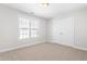 Cozy bedroom with natural light, neutral paint, and a closet at 4005 Freesia Ct, Zebulon, NC 27597
