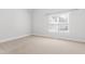 Bright bedroom with neutral carpet, a window and light walls at 4005 Freesia Ct, Zebulon, NC 27597