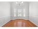 Bright and spacious dining room featuring hardwood floors, decorative molding, and recessed lighting at 4005 Freesia Ct, Zebulon, NC 27597