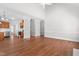Bright living room features hardwood floors and an open floorplan to the kitchen and staircase at 4005 Freesia Ct, Zebulon, NC 27597
