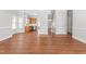 Spacious living room with hardwood floors leads to the kitchen, offering an open floor plan at 4005 Freesia Ct, Zebulon, NC 27597