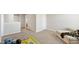 Open bonus room with neutral walls and carpet flooring with a tan sofa at 417 Sapphire Rd, Burlington, NC 27215