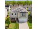 Two-story home featuring a two-car garage, a mix of siding, stone accents, and a well-maintained lawn at 417 Sapphire Rd, Burlington, NC 27215