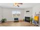 Open living area featuring a fireplace, laminate flooring, and ample natural light at 417 Sapphire Rd, Burlington, NC 27215