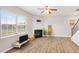 Bright, open living area with a fireplace, wood flooring, and modern decor at 417 Sapphire Rd, Burlington, NC 27215