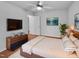 Comfortable bedroom with a ceiling fan, modern decor, and natural light for a relaxing ambiance at 48 Delmar Ct, Fuquay Varina, NC 27526