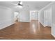 Spacious living room with hardwood floors, white trim, and natural light, perfect for gatherings at 48 Delmar Ct, Fuquay Varina, NC 27526