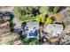 Aerial view of property showing a pool, patio, mature trees, and a long drive way at 509 Queensferry Rd, Cary, NC 27511