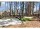 Well maintained sports court with basketball hoop, sand pit, and mini golf area at 509 Queensferry Rd, Cary, NC 27511