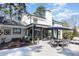 This backyard features a patio, a deck, and a sunroom with floor to ceiling windows at 509 Queensferry Rd, Cary, NC 27511