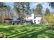 This large backyard features a pool, a slide, an outdoor kitchen, a lawn, and plenty of space at 509 Queensferry Rd, Cary, NC 27511
