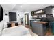 This basement features a bed, a laundry area, floating shelves, and a black accent wall with sconces at 509 Queensferry Rd, Cary, NC 27511