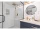 This bathroom features a glass walk-in shower with white subway tile and a stylish vanity with gold hardware and a marble countertop at 509 Queensferry Rd, Cary, NC 27511
