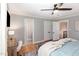 Bright bedroom featuring a wooden desk, hardwood floors, and natural light at 509 Queensferry Rd, Cary, NC 27511