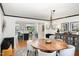 Elegant dining room featuring a round wood table, stylish light fixture, and open layout at 509 Queensferry Rd, Cary, NC 27511