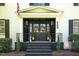 Inviting home entrance with wreaths on the black double doors and lantern lighting at 509 Queensferry Rd, Cary, NC 27511