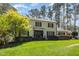 Charming two-story home featuring a well-manicured lawn, white brick, and black shutters at 509 Queensferry Rd, Cary, NC 27511