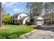 Charming two-story home with well-manicured lawn, mature shrubs and attached garage at 509 Queensferry Rd, Cary, NC 27511