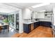 Modern kitchen boasts two-tone cabinets, stainless steel appliances, and a bright, airy feel with an adjacent breakfast nook at 509 Queensferry Rd, Cary, NC 27511