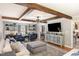 Open living room with wood beam ceilings and built-in shelving at 509 Queensferry Rd, Cary, NC 27511
