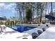This backyard features a luxurious pool with a slide, jacuzzi, and seating at 509 Queensferry Rd, Cary, NC 27511