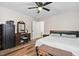 Comfortable bedroom featuring wood floors, a ceiling fan and a vintage vanity at 513 S Cheatham St, Franklinton, NC 27525