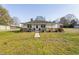 Charming one-story home with a inviting front porch, walkway, and a spacious front yard at 513 S Cheatham St, Franklinton, NC 27525