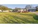 Charming home exterior featuring a covered porch and well-maintained front lawn at 513 S Cheatham St, Franklinton, NC 27525