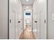 Hallway with closet and an open door that allows viewing into the bathroom at 513 S Cheatham St, Franklinton, NC 27525